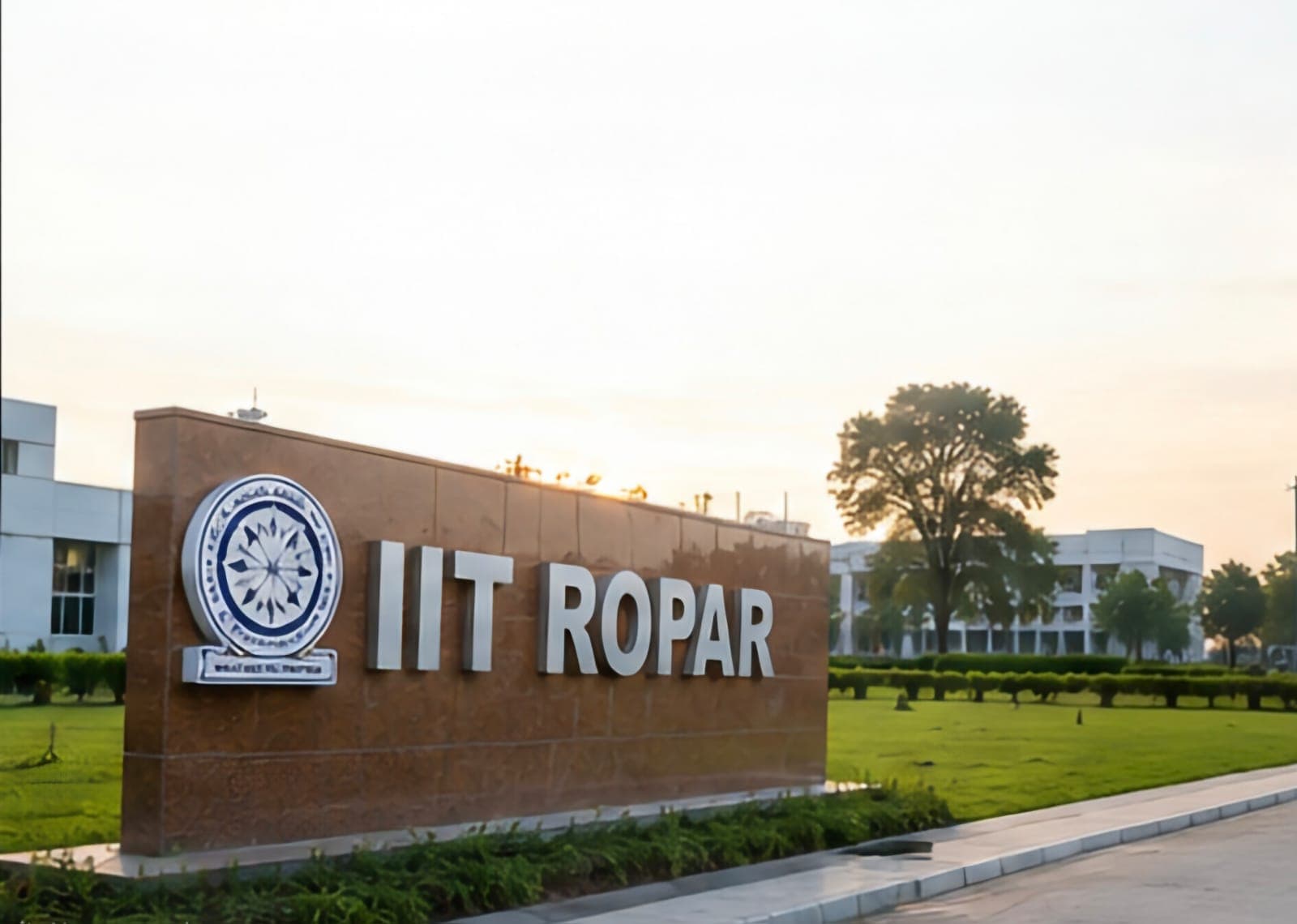 IIT Ropar campus entrance signage with academic block visible at sunset.